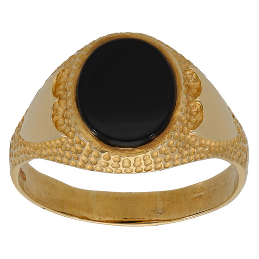 Gold oval onyx signet ring with raised textured pattern bezel