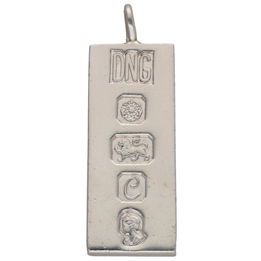 Sterling silver ingot pendant with DNG mark and three small engraved emblems