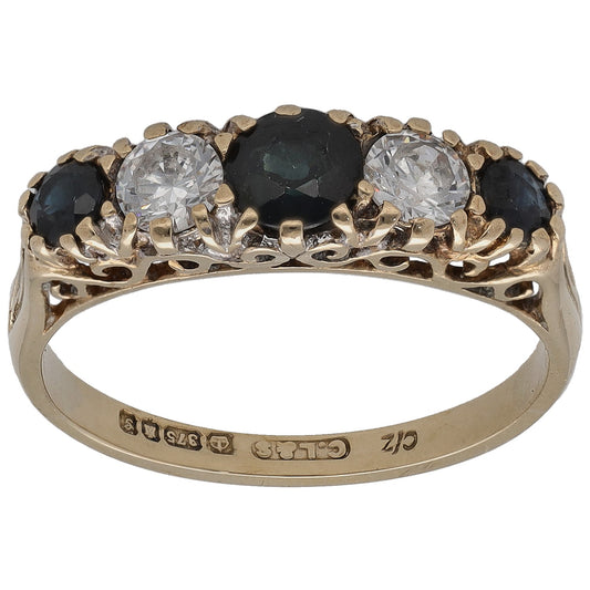 Gold half eternity ring with round clear CZ and dark sapphire-toned stones