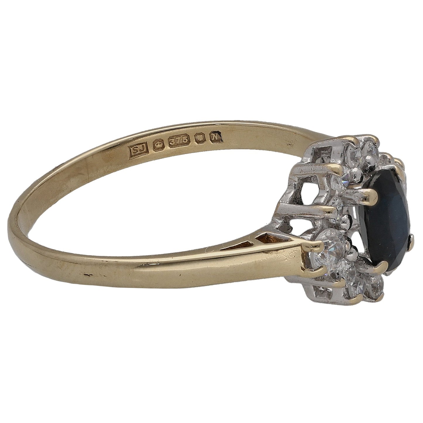 Gold ring with oval dark center stone and CZ accents, side view with hallmark band