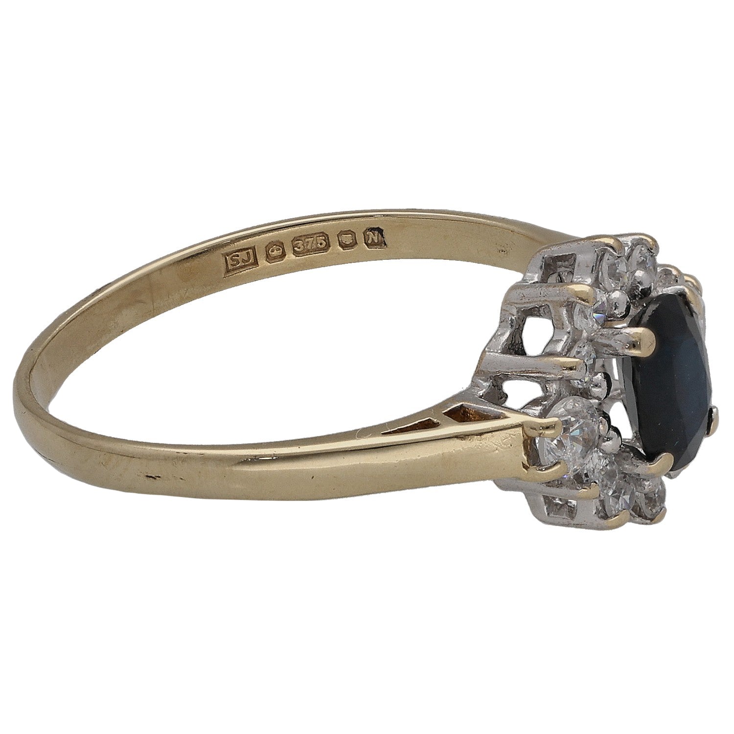 Gold ring with oval dark center stone and CZ accents, side view with hallmark band