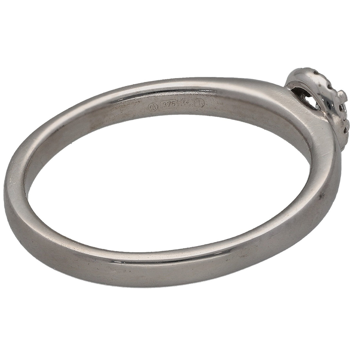 White gold ring band with round diamond cluster at side, inside hallmark visible