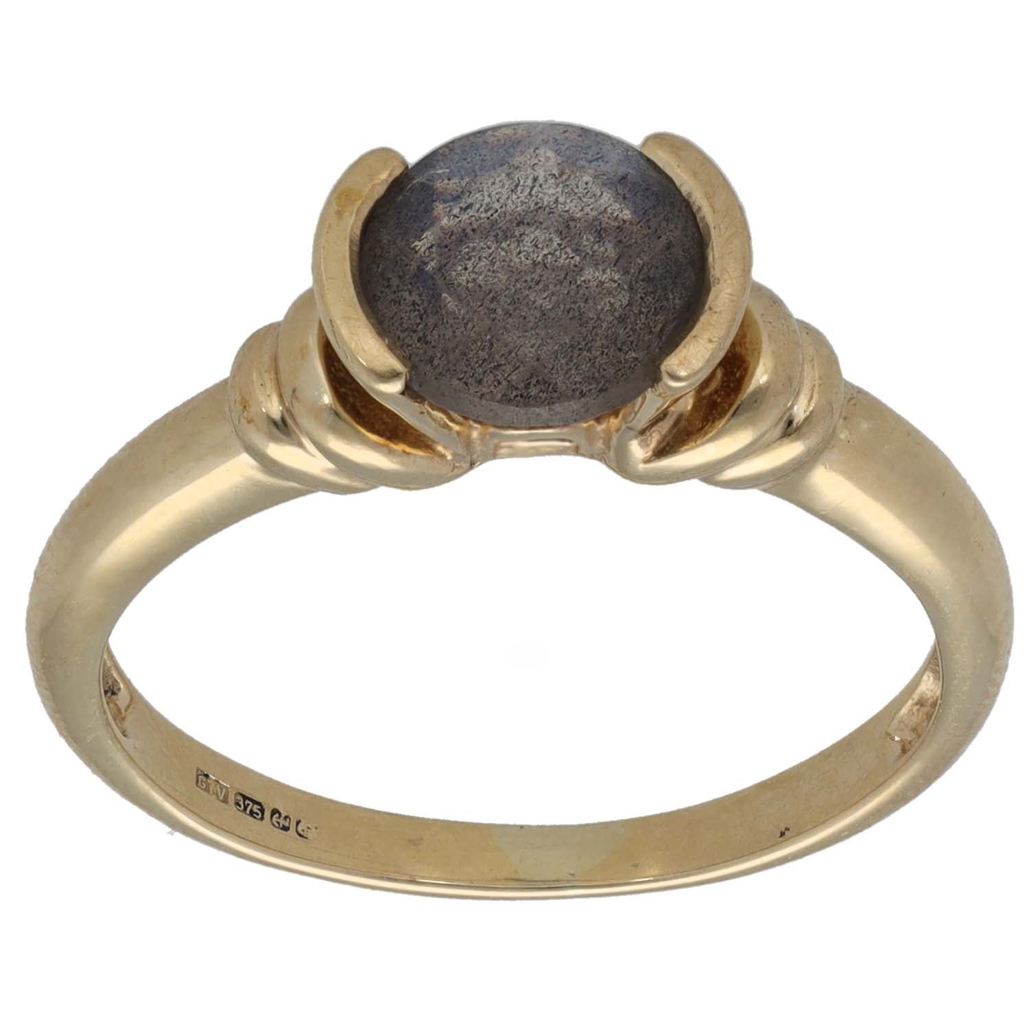 Gold single-stone ring with dark round feldspar set in claw prongs