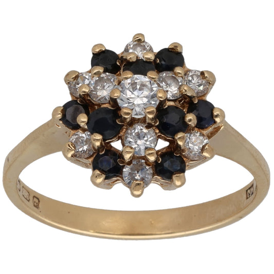 Gold cocktail ring with clear CZ cluster and dark round stones