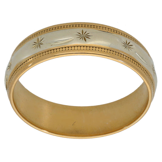 Two-tone gold wedding ring with gold beaded edge and starburst leaf pattern
