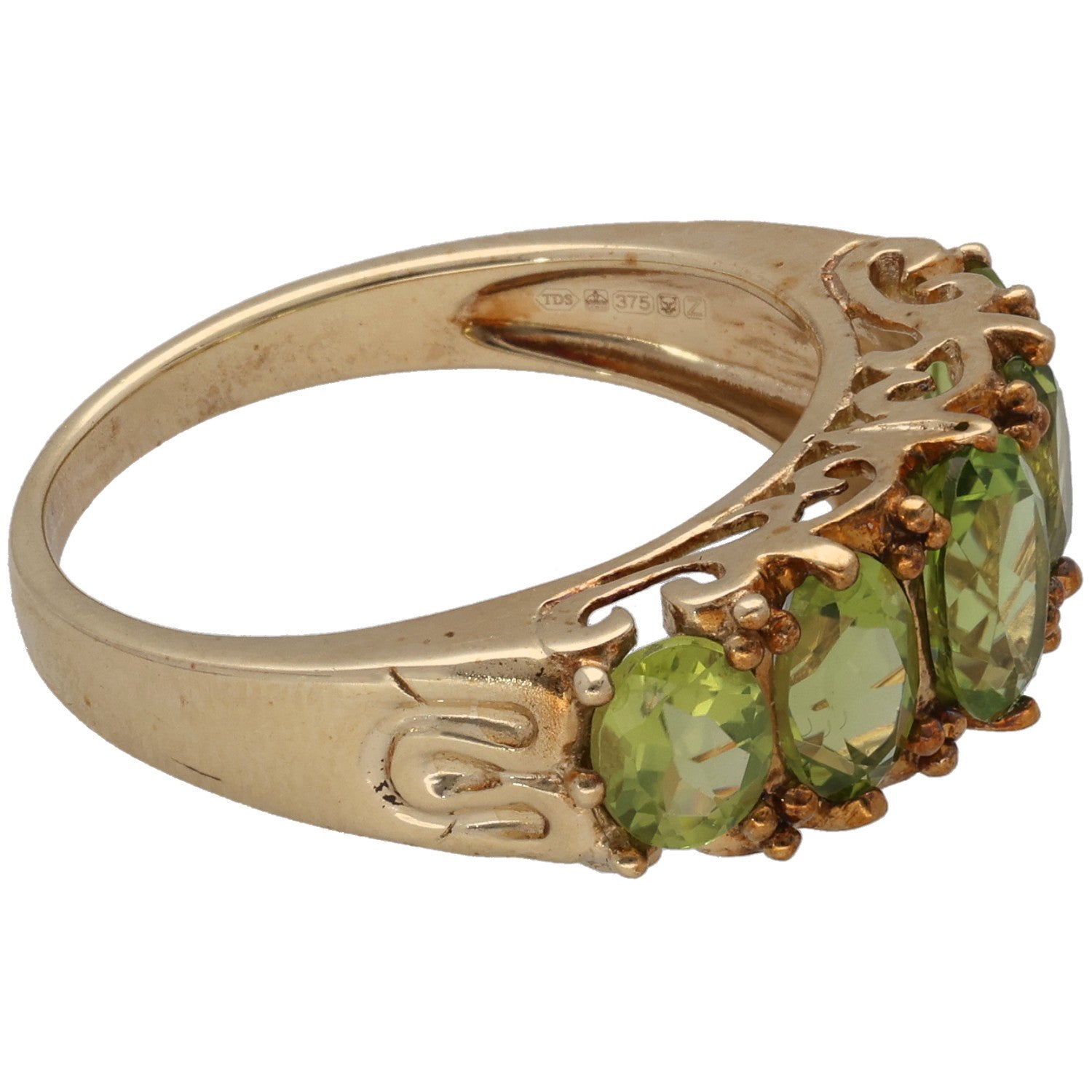 9ct gold ring side view with oval green peridot stones and openwork detailing