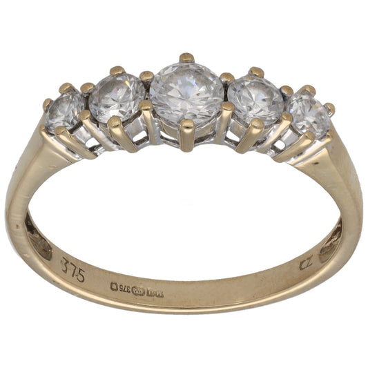 Gold half-eternity CZ ring with round clear stones in gold bezel settings