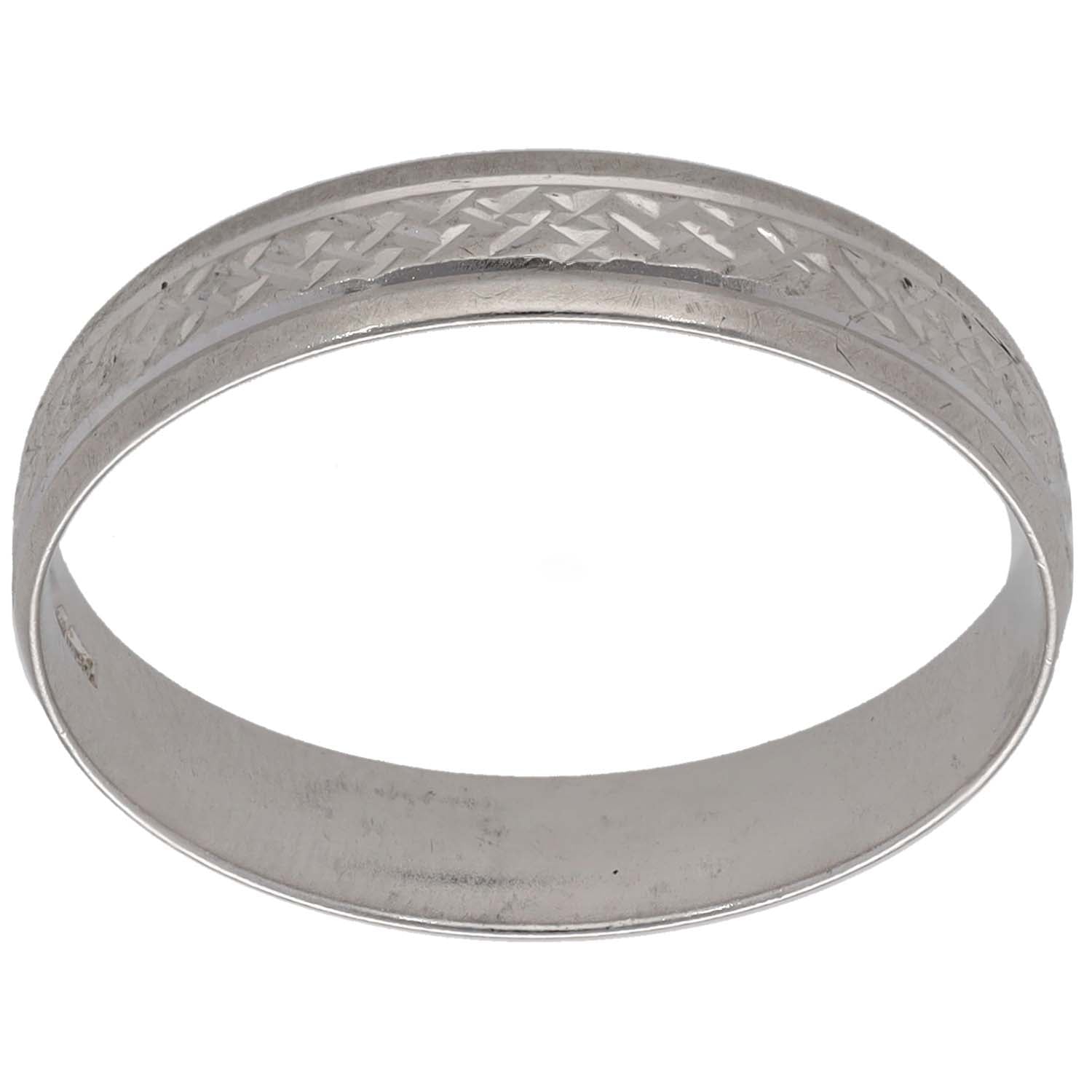 White gold patterned wedding band with textured diamond-cut side detail
