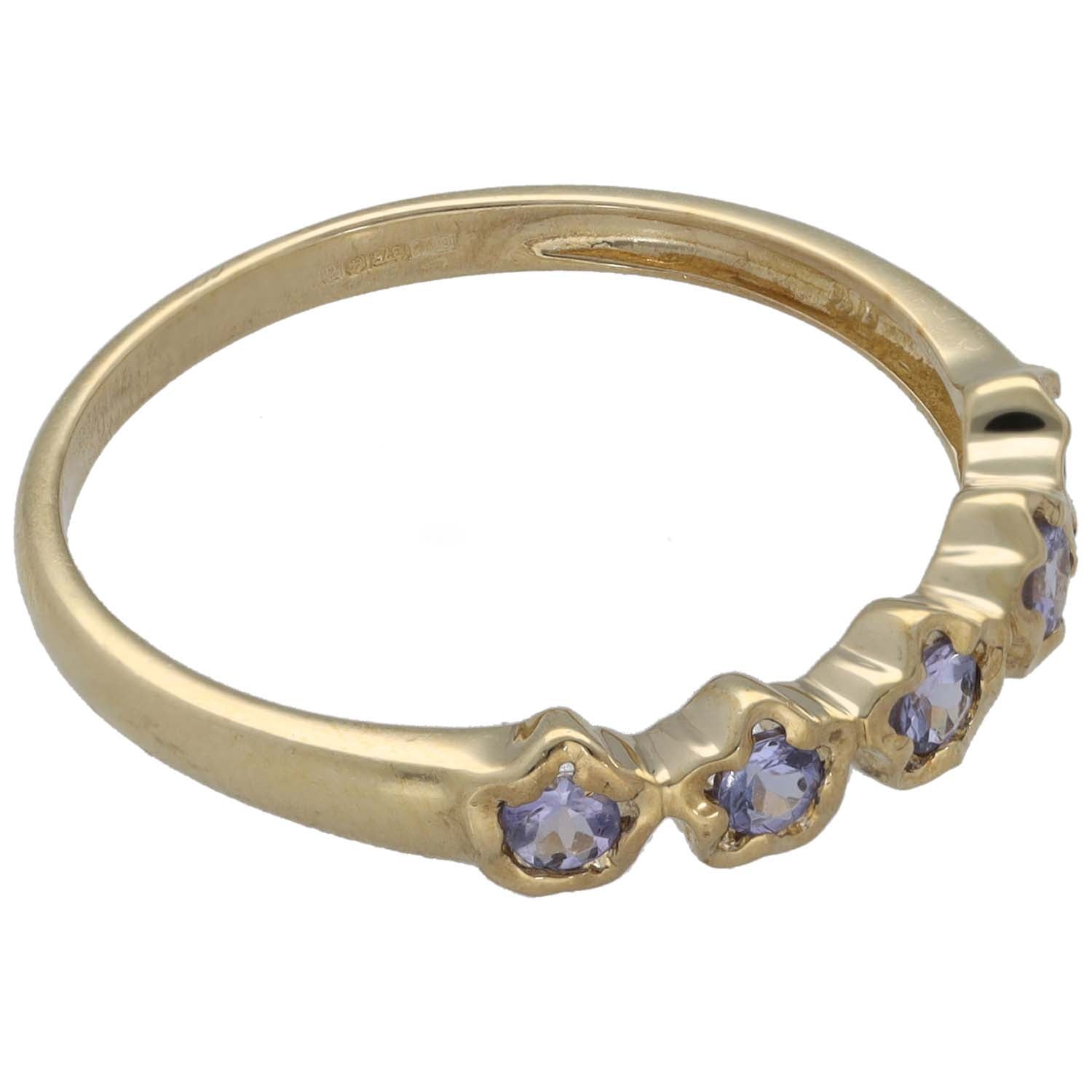 9ct gold half eternity ring side view with purple tanzanite-style stones on band