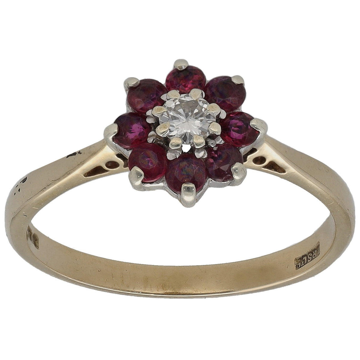 Gold ring with ruby cluster and round diamond center on split prongs