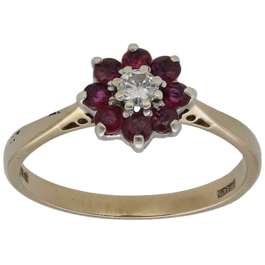 Gold ring with ruby cluster and round diamond center on split prongs