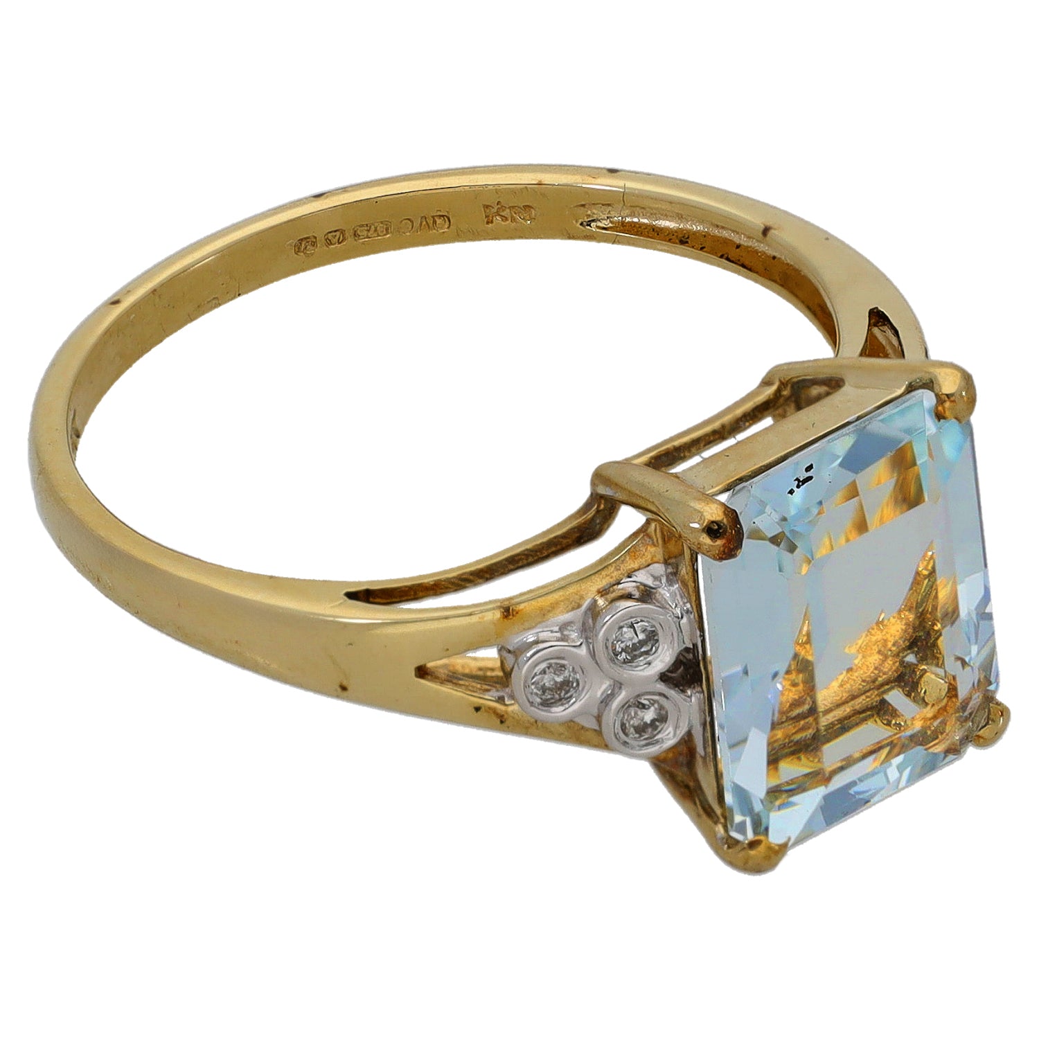 Gold ring with rectangular aquamarine center stone and diamond side accents