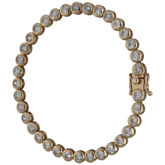 Gold-tone tennis-style bracelet with round CZ stones and padlock clasp.