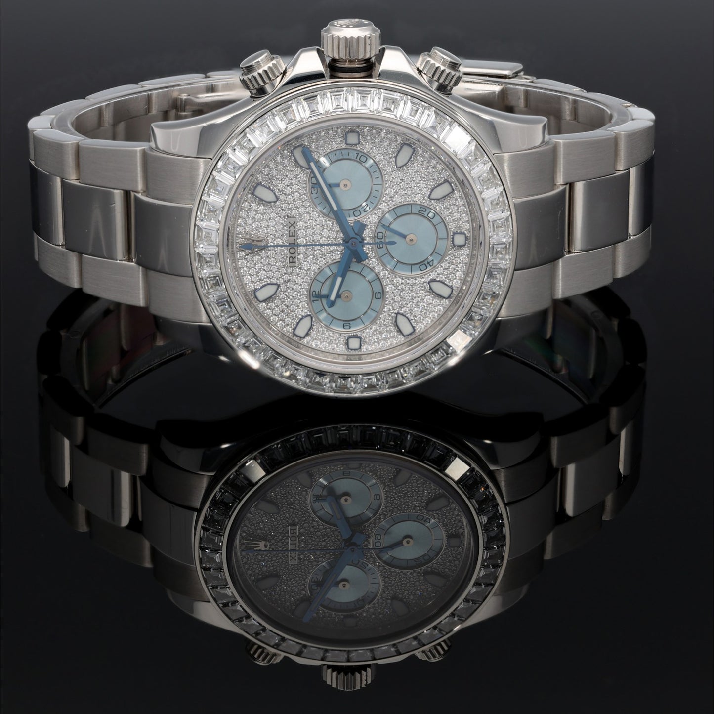 Platinum Rolex Daytona 116576TBR chronograph watch top view, light blue dial, diamond accents, steel bracelet