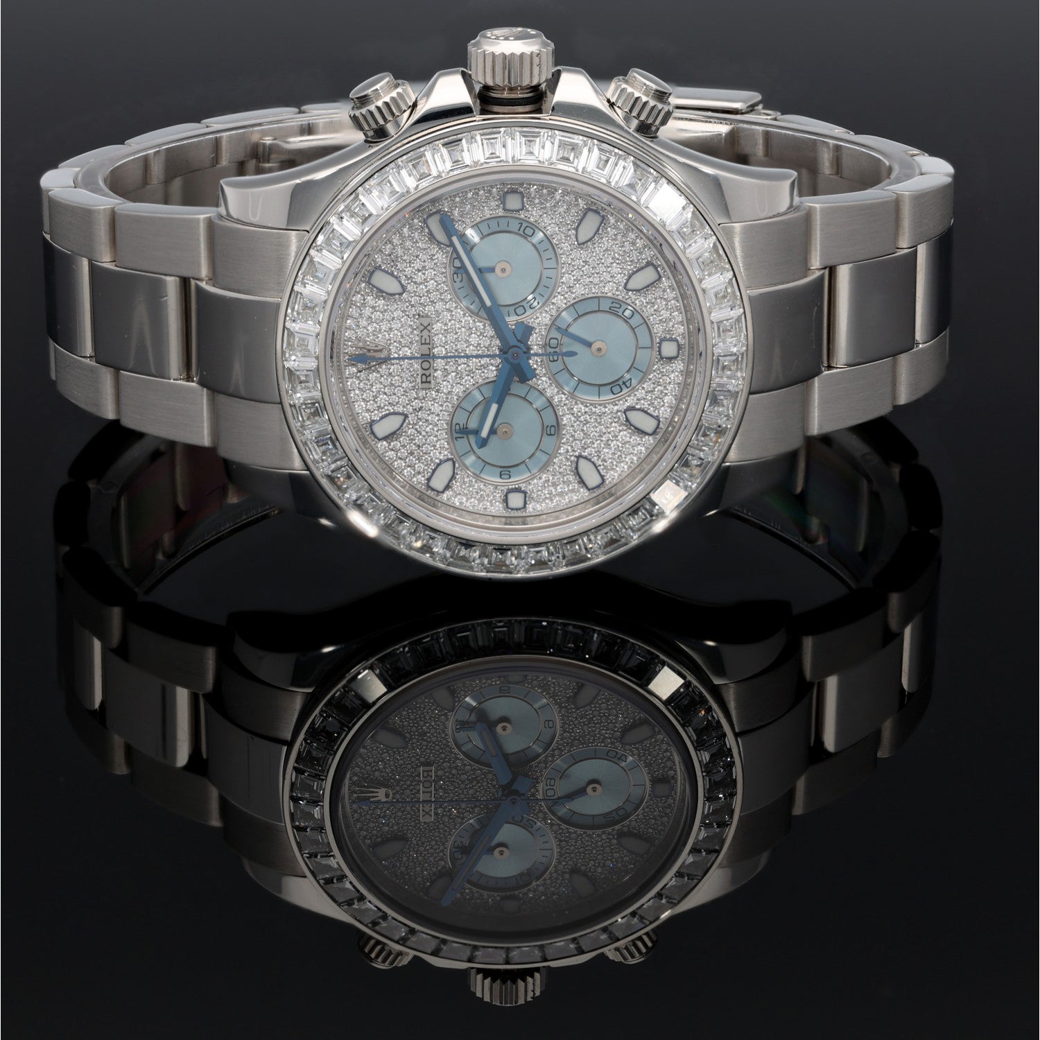 Platinum Rolex Daytona 116576TBR chronograph watch top view, light blue dial, diamond accents, steel bracelet