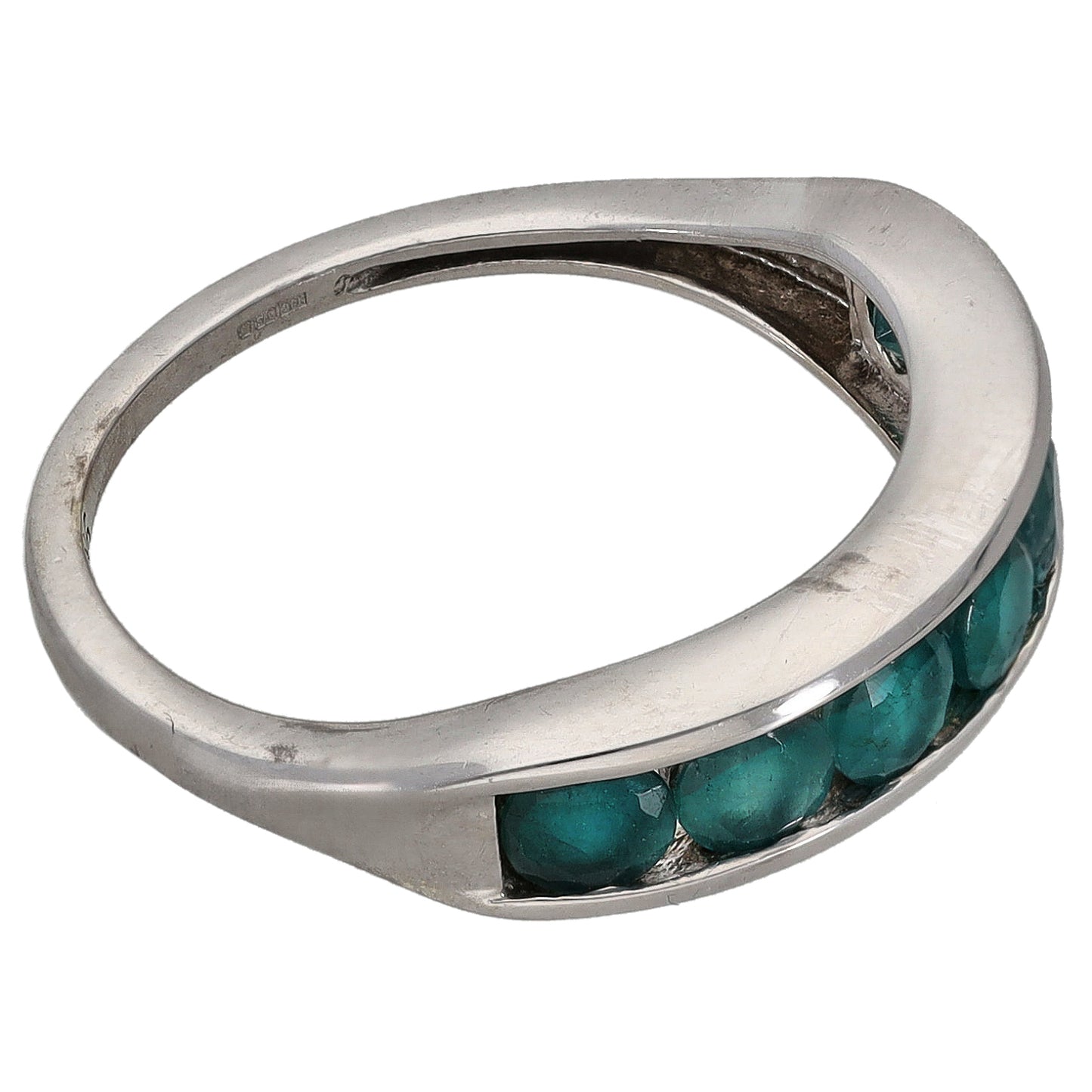 White gold half eternity ring with teal gemstones along the band edge