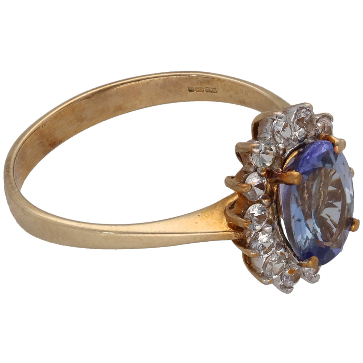 9ct gold ring with large oval blue center stone and clear cluster side accents