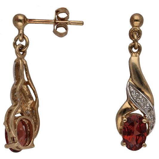 9ct gold drop earrings with red garnet teardrop and small diamond accents