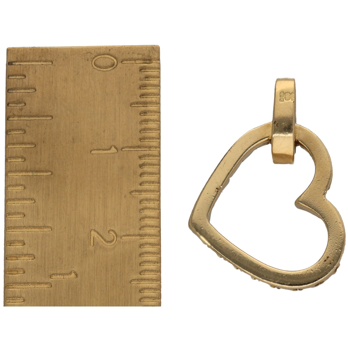 Gold heart pendant with round diamond accents; bail and heart outline