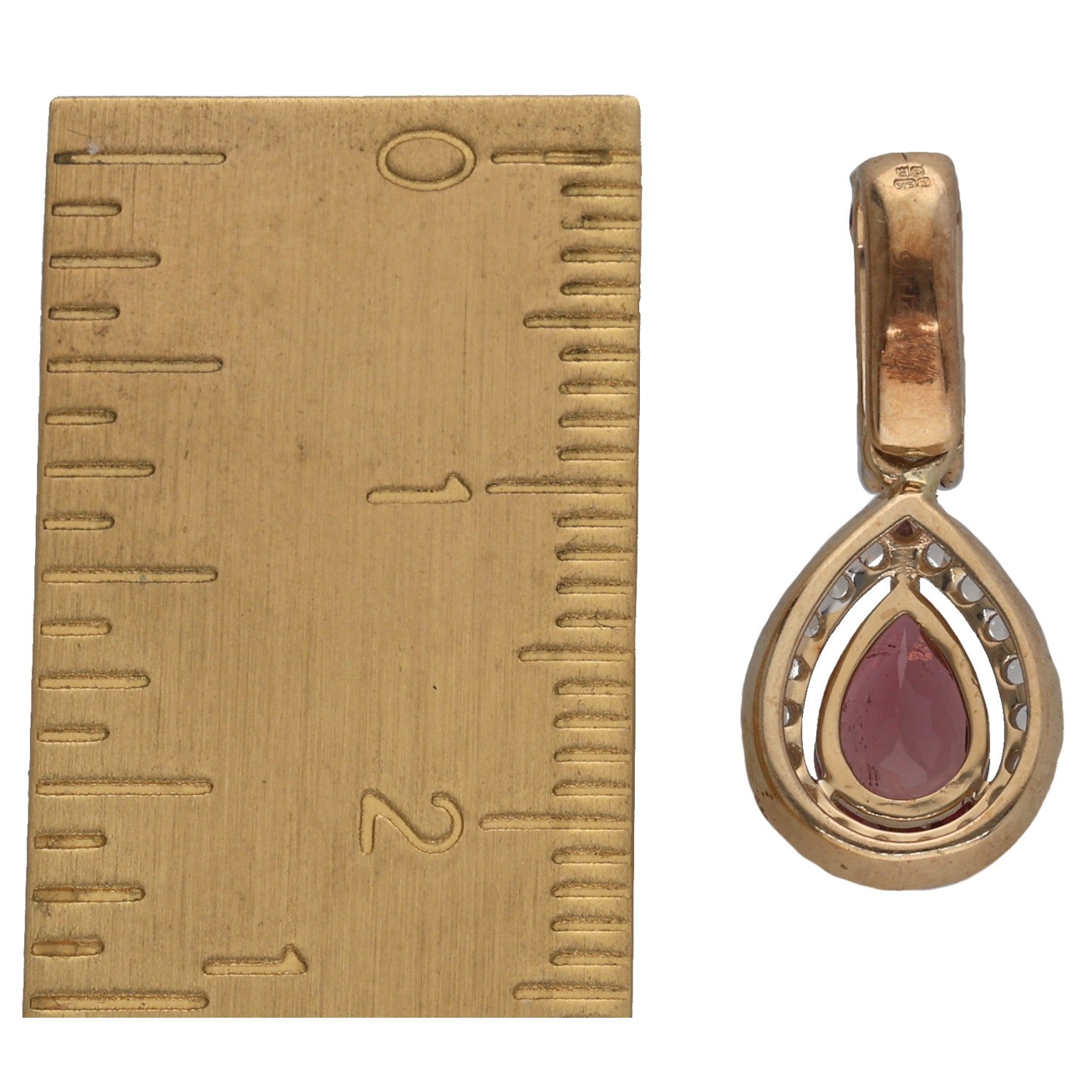 Gold teardrop pendant with maroon stone and white diamond halo, bail loop