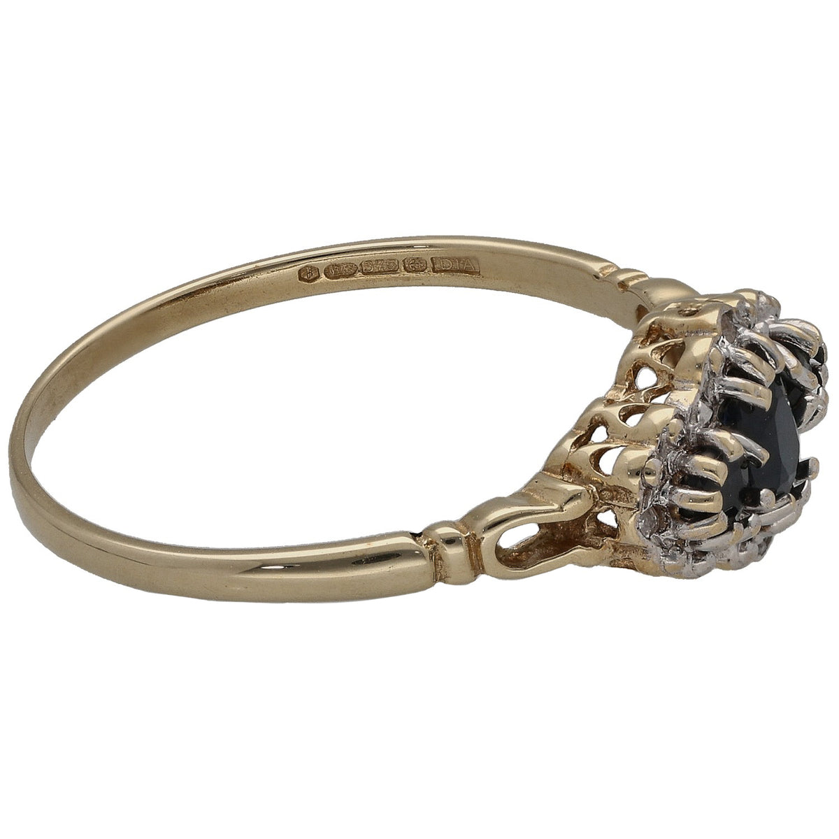 9ct gold ring with cluster setting and dark gemstone, visible gallery and prongs