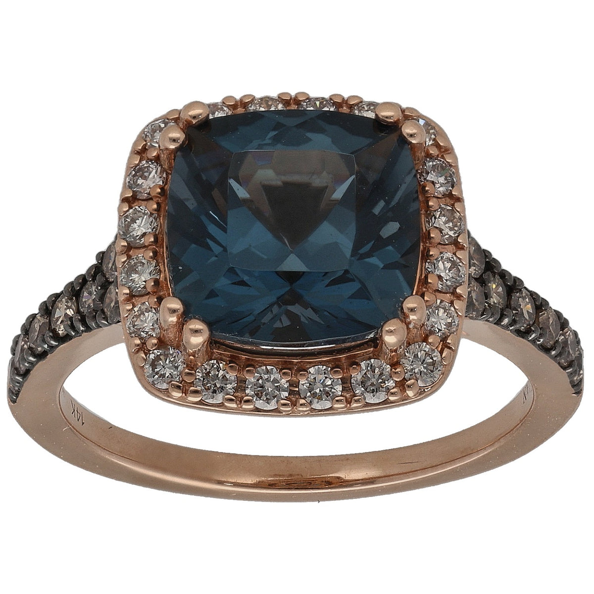 Gold dress ring with cushion-cut blue center stone and pavé diamond band