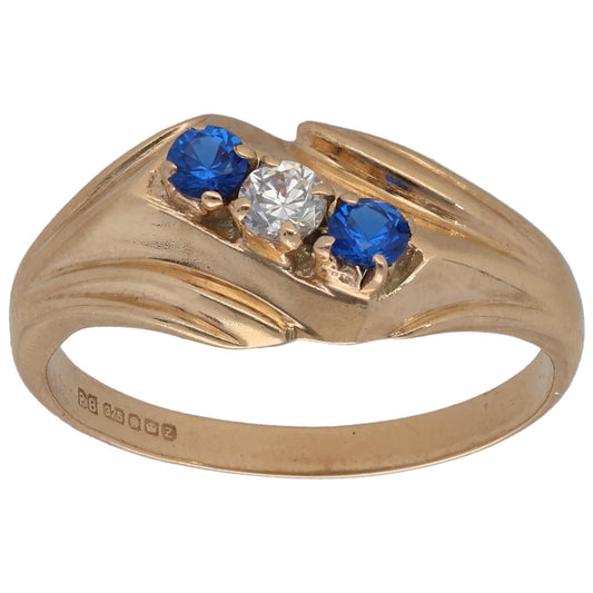 Gold-tone three-stone ring with center clear stone and two blue stones