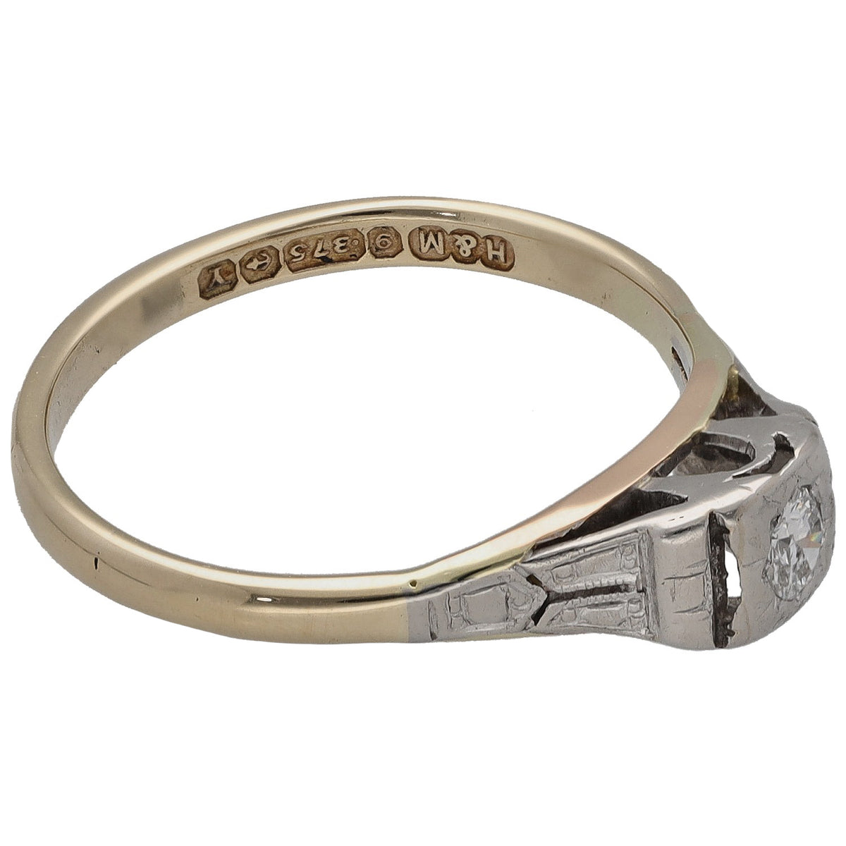 Bicolour gold solitaire ring with round diamond set in raised setting