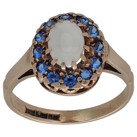 9ct gold cocktail ring, oval opal center with blue sapphire halo, size K