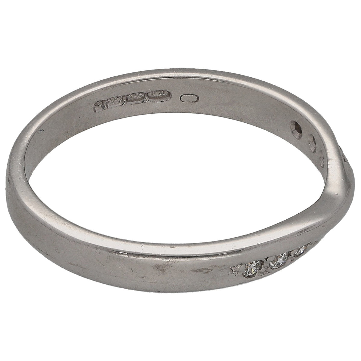 White gold half-eternity ring side view with round diamond stones and hallmark