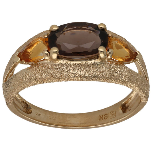 Gold dress ring with smoky quartz oval center and citrine marquise side stones