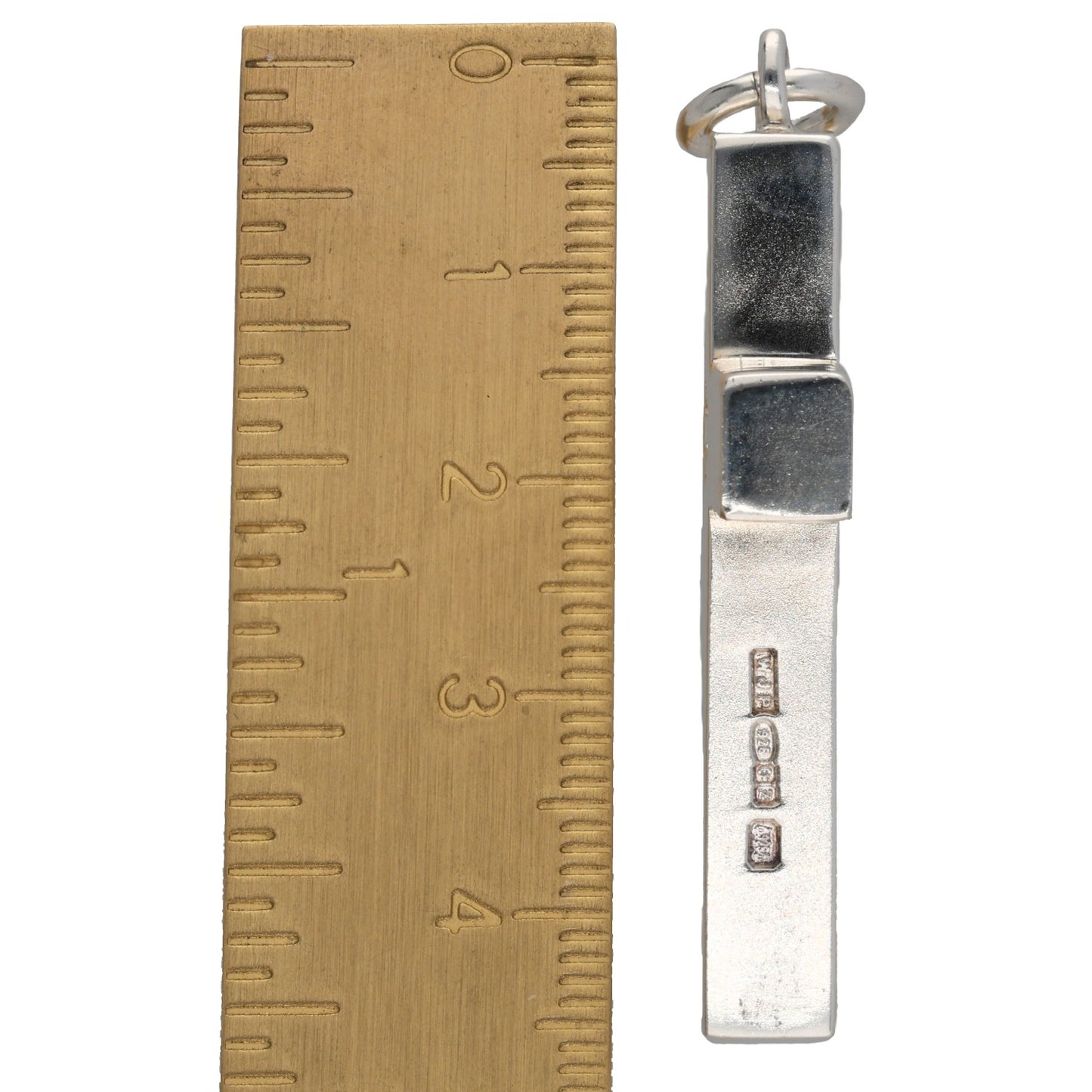 Sterling silver cross pendant back with stamped details, vertical bail, shown with size ruler.