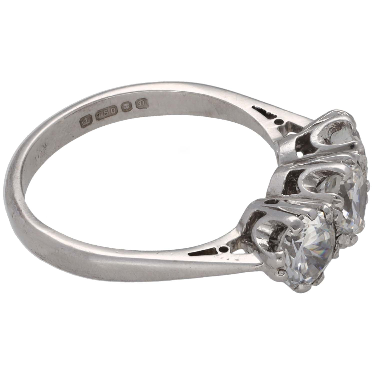 Three-stone CZ ring side view: white gold tone band with round clear stones