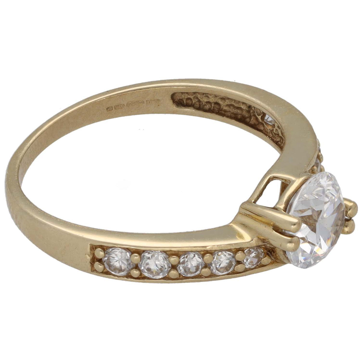 Gold-tone CZ ring showing oval-cut side accents and round center stone, hallmark inside