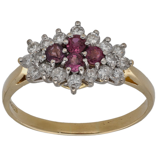 Yellow gold dress ring with oval ruby center, surrounded by round diamond clusters on band