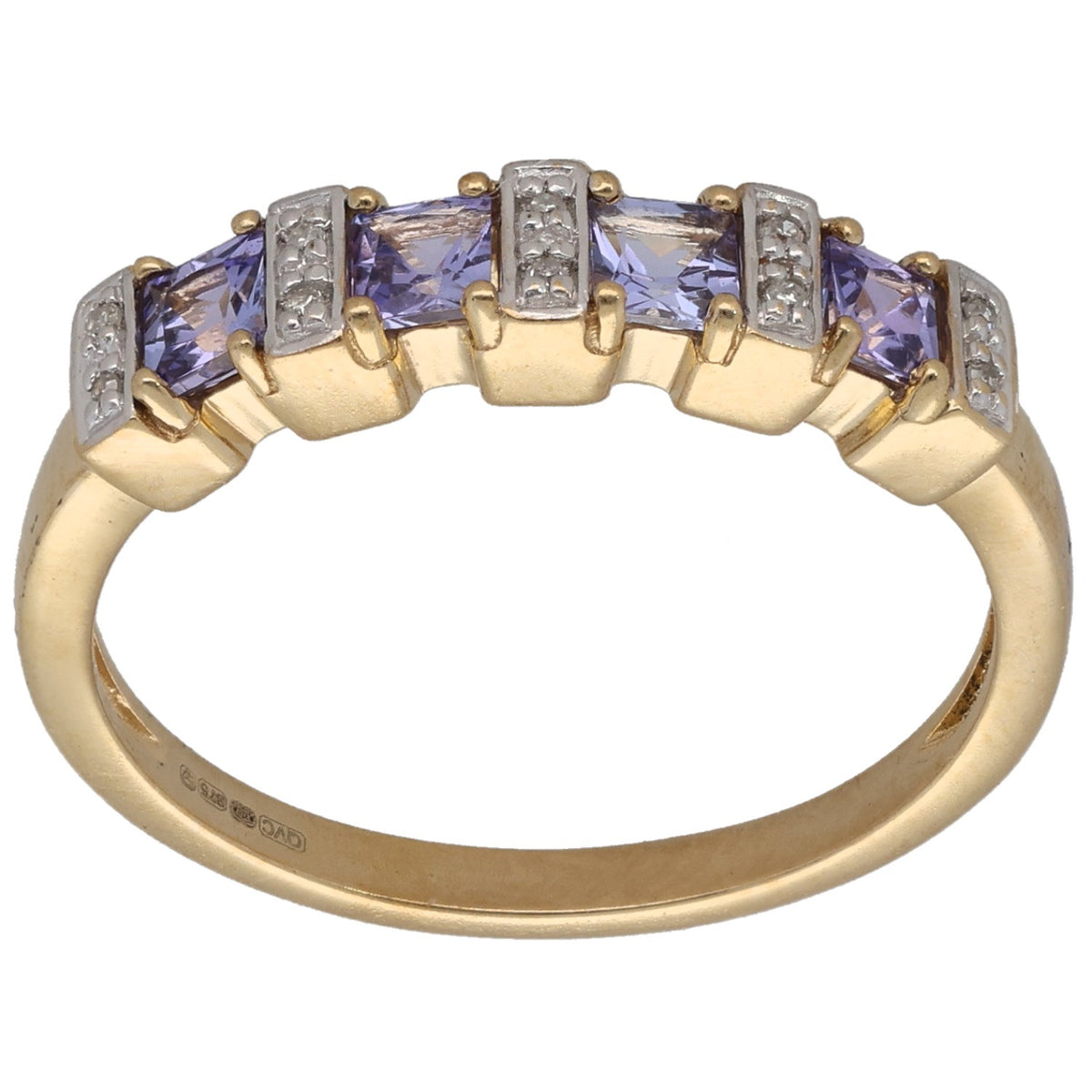 Gold cocktail ring with purple gemstone and diamond accents set in prongs