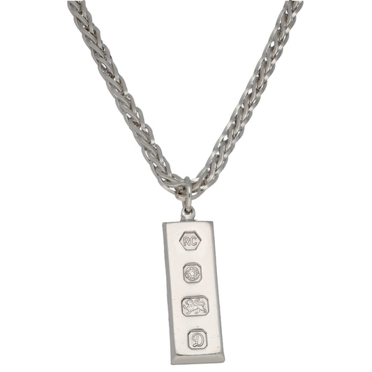 Sterling silver ingot pendant with small engraved symbols, on link chain