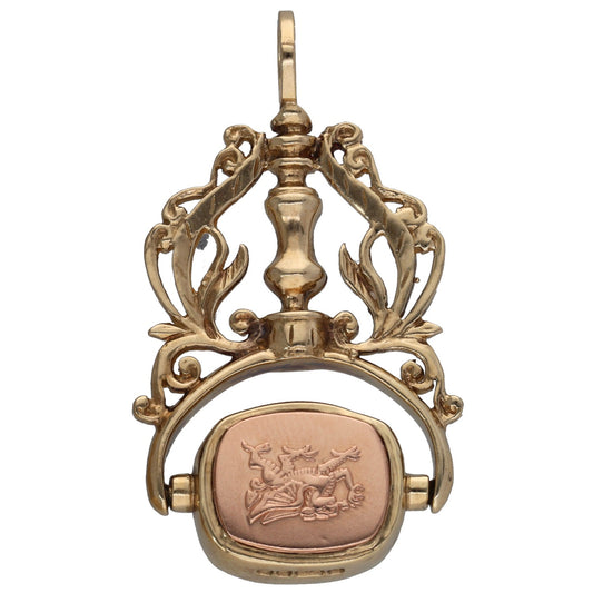 Gold filigree fob pendant with oval gemstone inset and top bail