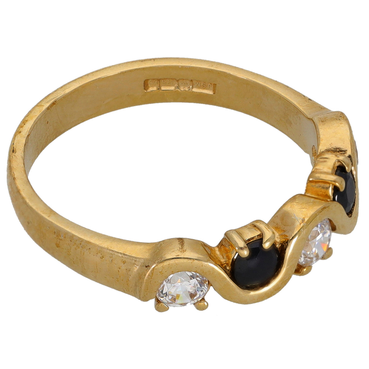 Gold ring with clear stones and dark accents, half-eternity bezel setting