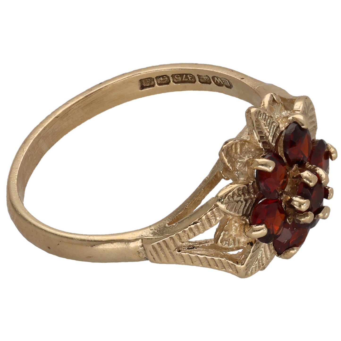 9ct gold garnet cocktail ring with red gemstone cluster, engraved band, and leaf shoulders