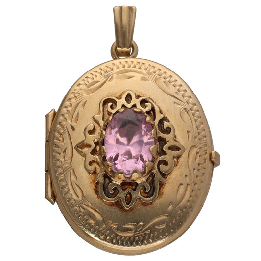 Oval gold locket pendant with patterned engraving and pink CZ gemstone center