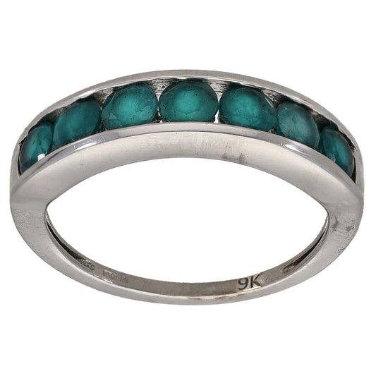 White gold half eternity ring with a row of teal gemstones across the top