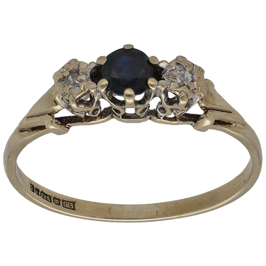 9ct gold sapphire and diamond three-stone ring with round dark blue center stone