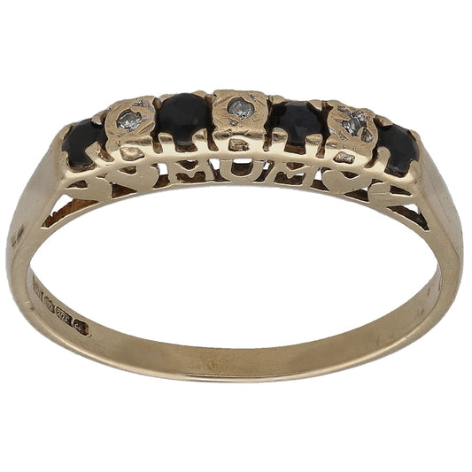 9ct gold half eternity ring with dark round gemstones and diamond accents