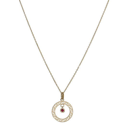 Gold-tone round pendant necklace with red faux-ruby center and Greek-key border