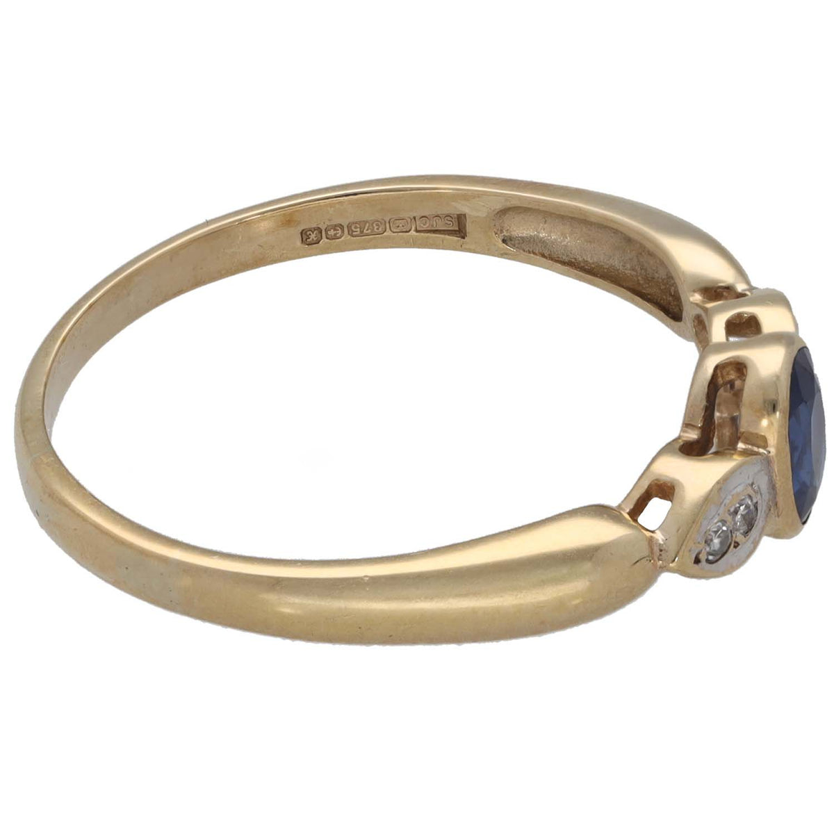 9ct gold sapphire and diamond ring, side view with blue gemstone and small diamond accents