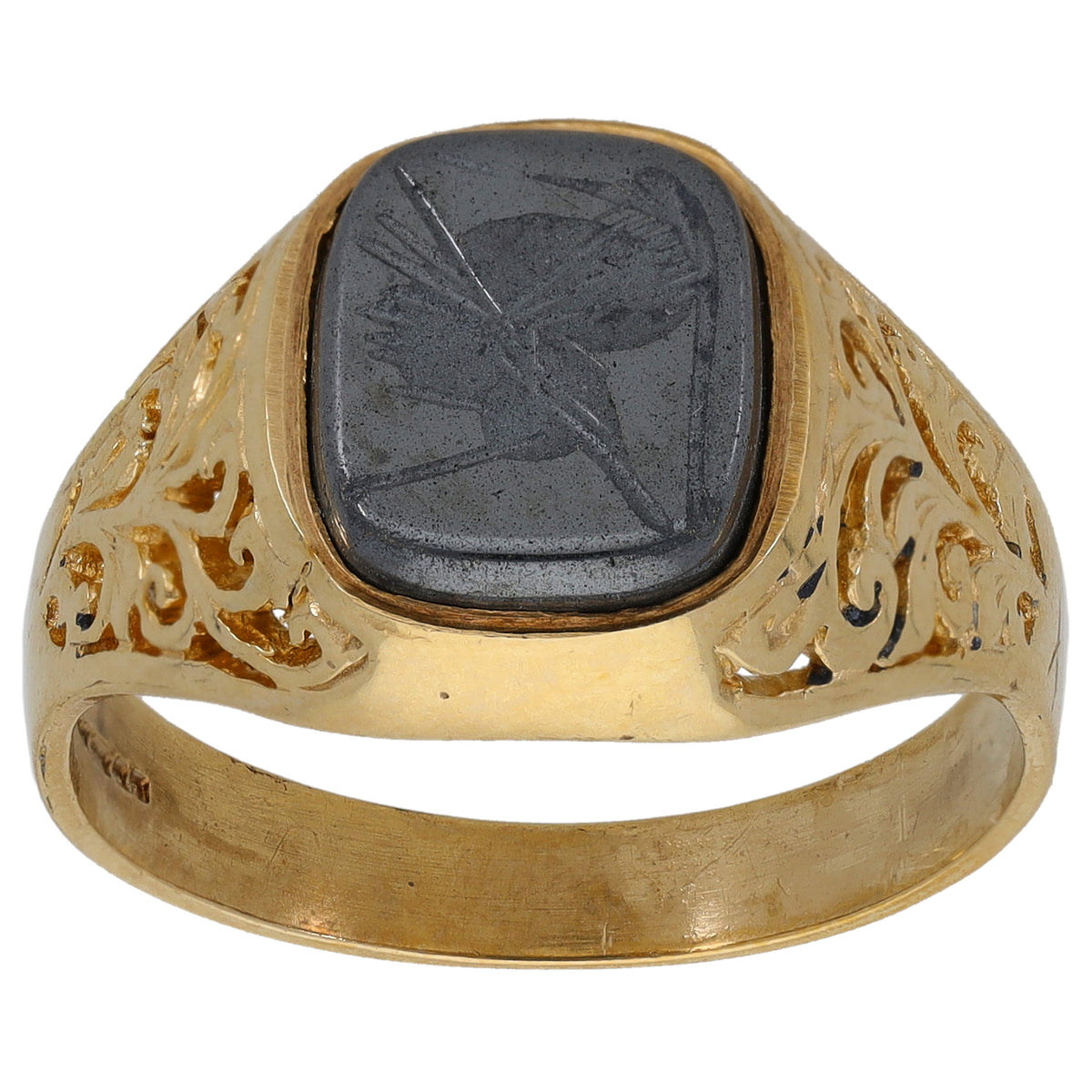 Gold signet ring with oval dark hematite crest stone and carved gold emblem