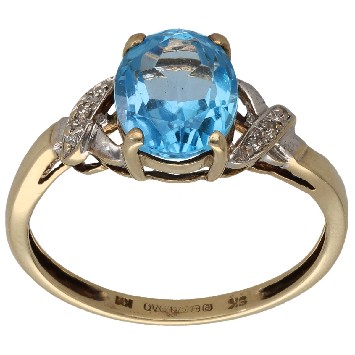 9ct gold ring with oval blue topaz and small diamond accents, prong-set