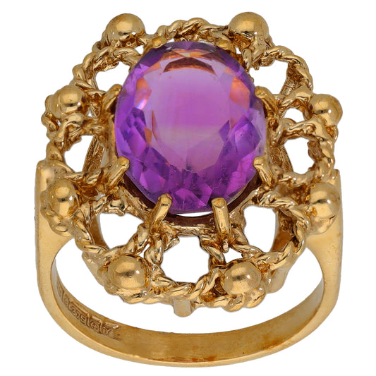 9ct gold amethyst ring with round faceted purple gemstone in decorative openwork basket