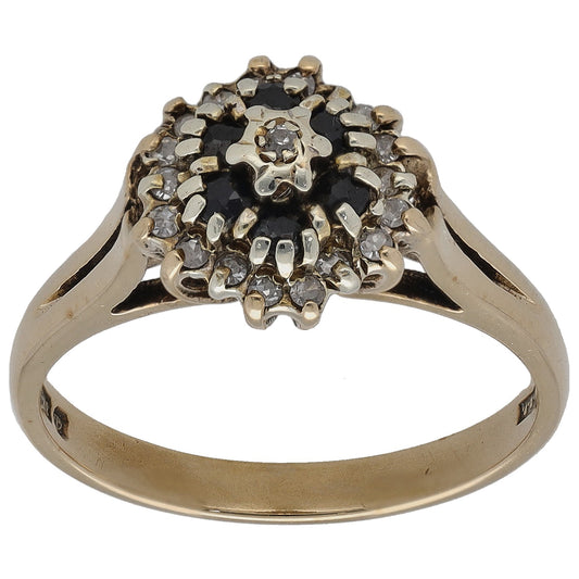 9ct gold dress ring with dark gemstone halo and round diamonds